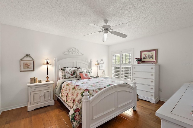 bedroom with wood-type flooring, a textured ceiling, and ceiling fan