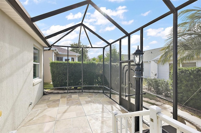 view of patio / terrace with a lanai