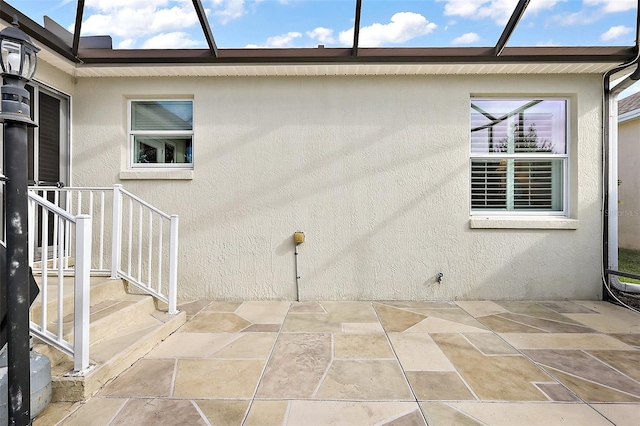 view of side of home featuring a patio area