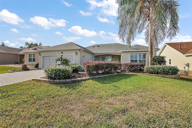 ranch-style house featuring a front lawn and a garage