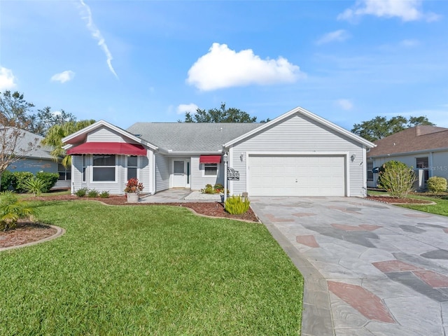 ranch-style home featuring a front yard and a garage