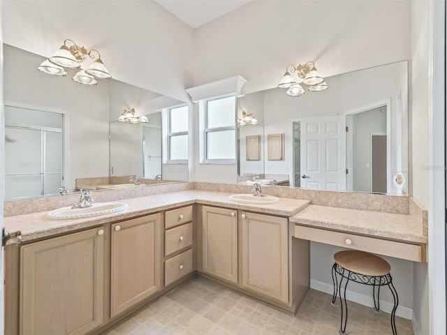 bathroom featuring vanity, walk in shower, and an inviting chandelier