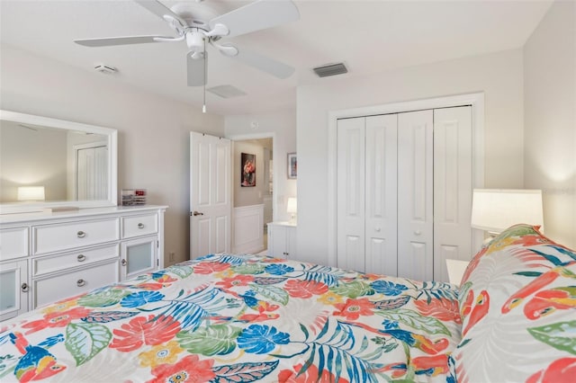 bedroom featuring ceiling fan, a closet, and visible vents