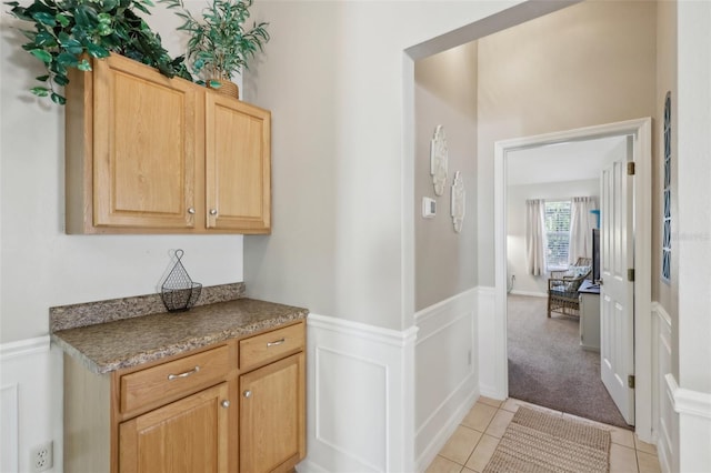 hall with light tile patterned flooring