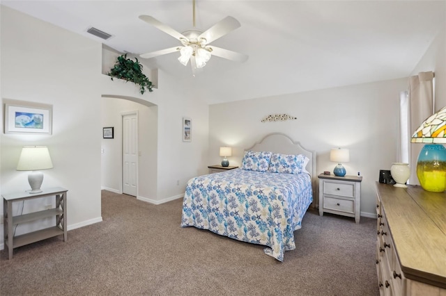 bedroom featuring ceiling fan and dark carpet