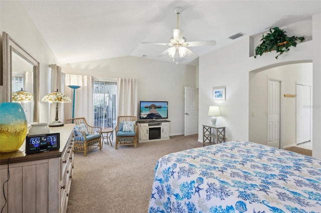 bedroom featuring ceiling fan, light colored carpet, and vaulted ceiling