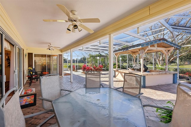 view of patio / terrace with glass enclosure and ceiling fan