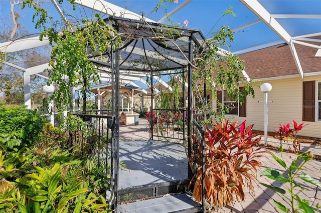 view of patio / terrace with glass enclosure