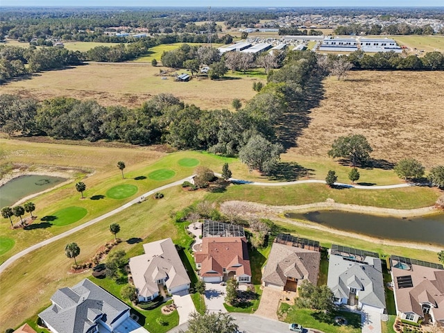 drone / aerial view with a residential view and golf course view