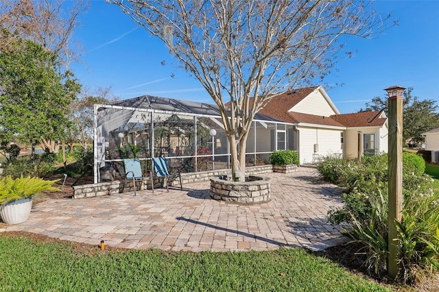 view of patio featuring a lanai