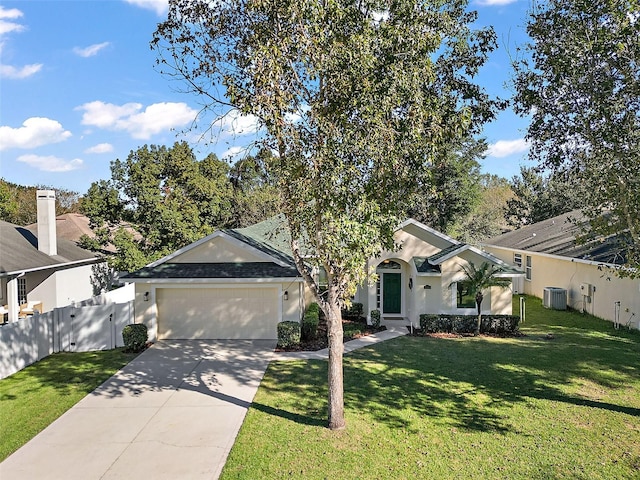 view of front of property featuring a garage, central air condition unit, and a front lawn