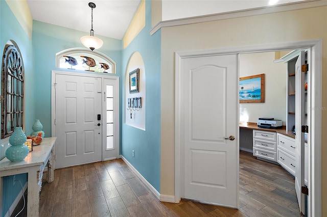 foyer entrance featuring lofted ceiling and dark wood-type flooring