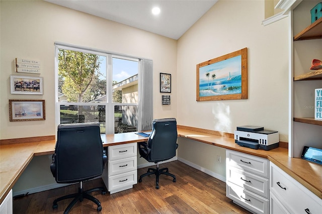 office space with dark wood-type flooring and built in desk