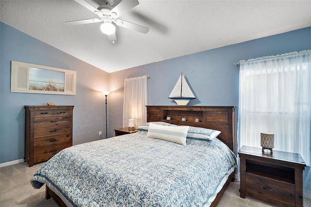 bedroom featuring light carpet, ceiling fan, and lofted ceiling