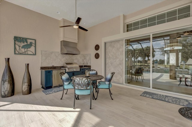 dining space featuring light hardwood / wood-style flooring and ceiling fan