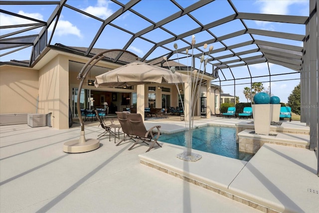 view of pool featuring glass enclosure and a patio area