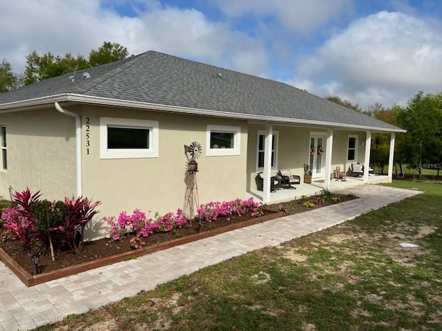 rear view of property featuring a patio area