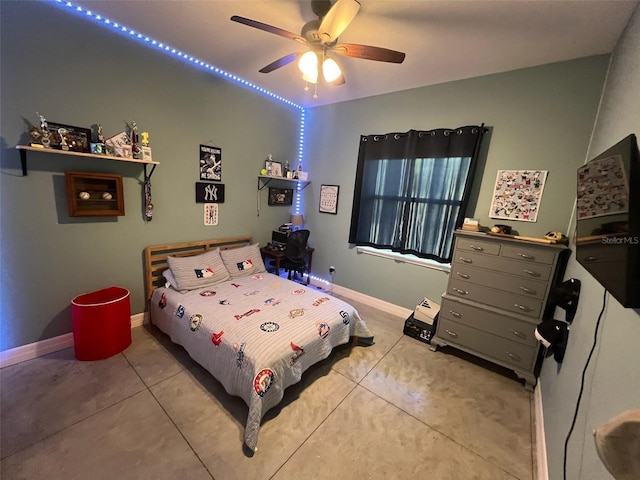 tiled bedroom featuring ceiling fan