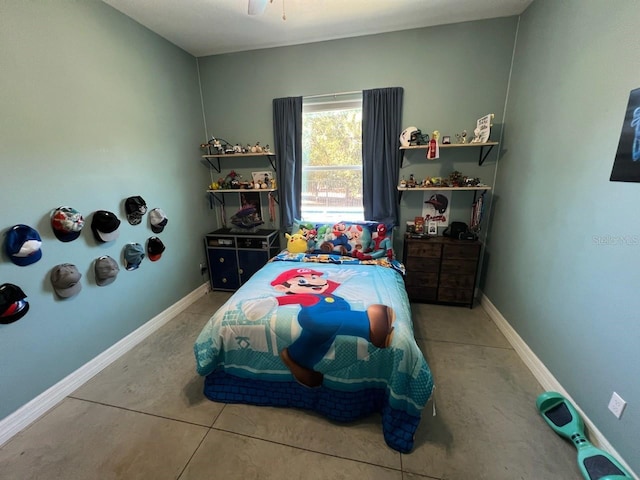 bedroom featuring tile patterned floors and ceiling fan