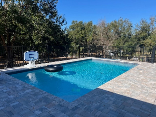 view of swimming pool featuring a patio