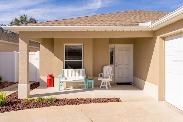 entrance to property with a patio