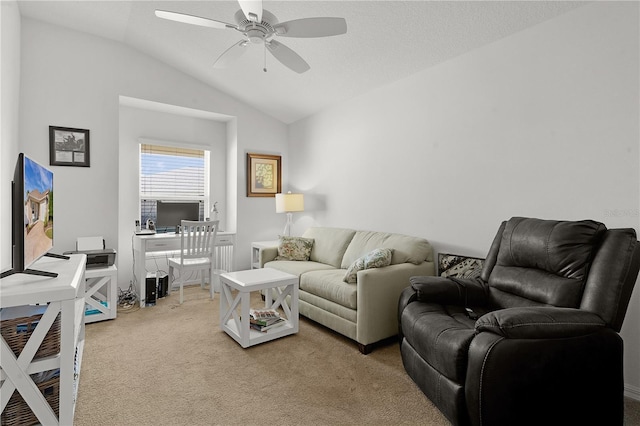 living room with ceiling fan, light colored carpet, and vaulted ceiling