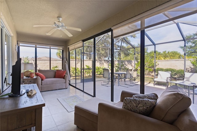 sunroom featuring ceiling fan