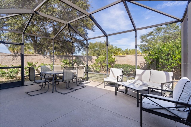 view of patio with outdoor lounge area and a lanai