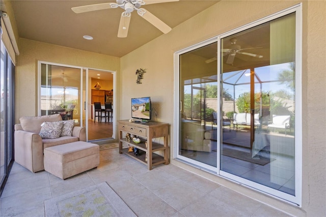 sunroom / solarium with a wealth of natural light and ceiling fan