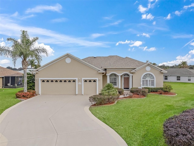 ranch-style home with a garage and a front yard