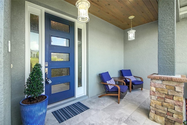 view of exterior entry with covered porch