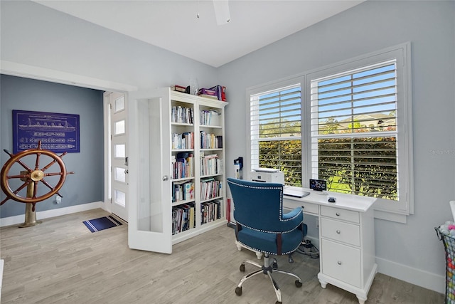 office space featuring light hardwood / wood-style flooring and ceiling fan