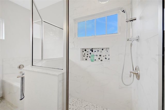 bathroom featuring tiled shower