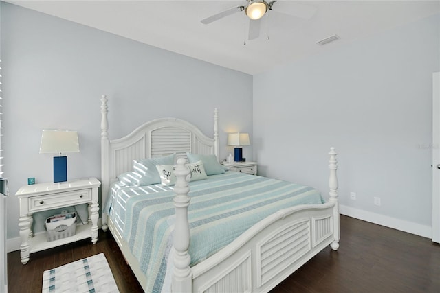 bedroom with ceiling fan and dark hardwood / wood-style flooring