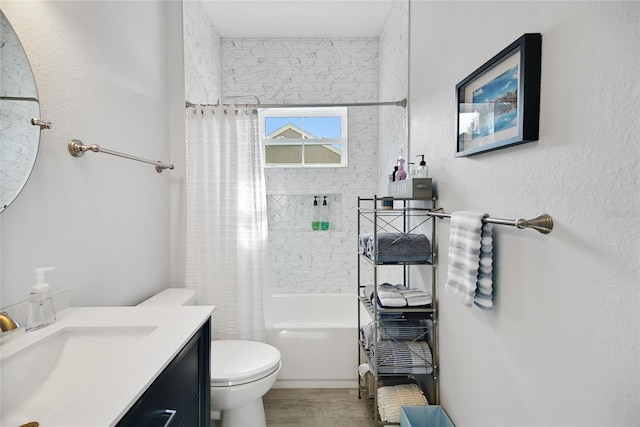 full bathroom featuring toilet, vanity, hardwood / wood-style flooring, and shower / tub combo with curtain