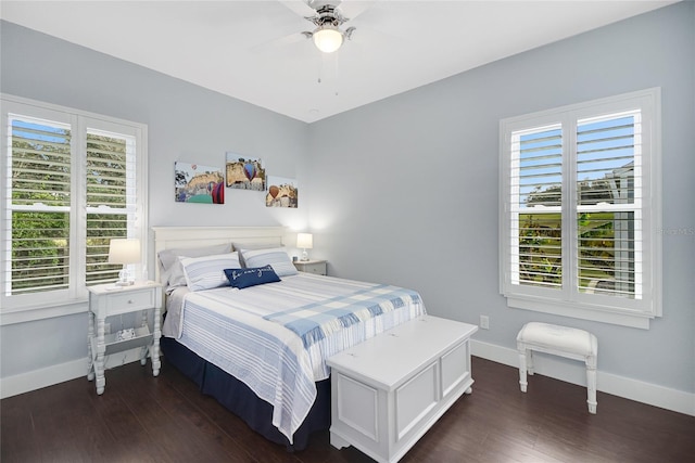 bedroom with ceiling fan and dark wood-type flooring