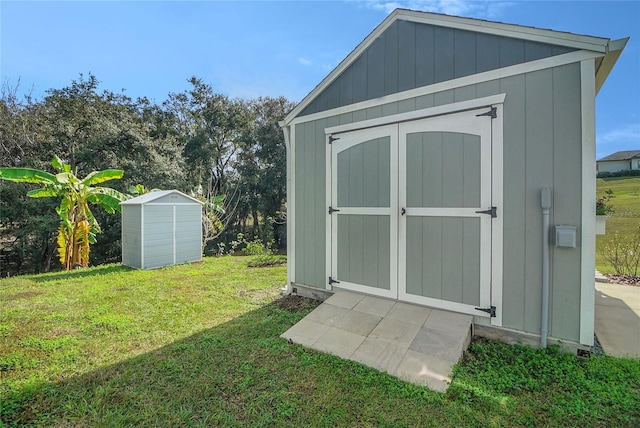 view of outbuilding with a yard