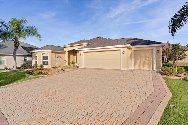 ranch-style home featuring a front yard and a garage