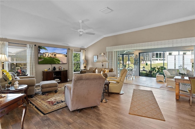 living room with ceiling fan, light hardwood / wood-style floors, lofted ceiling, and crown molding