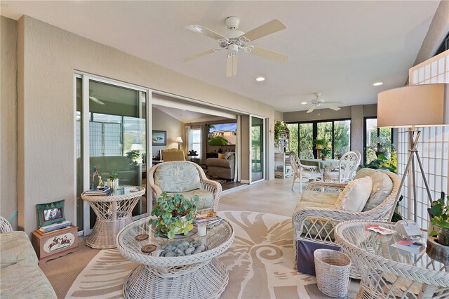 sunroom / solarium with ceiling fan