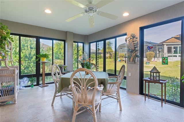 sunroom with plenty of natural light and ceiling fan