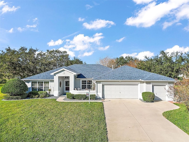 ranch-style house with a garage and a front lawn