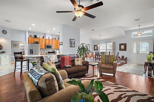 living room with ceiling fan and light hardwood / wood-style floors