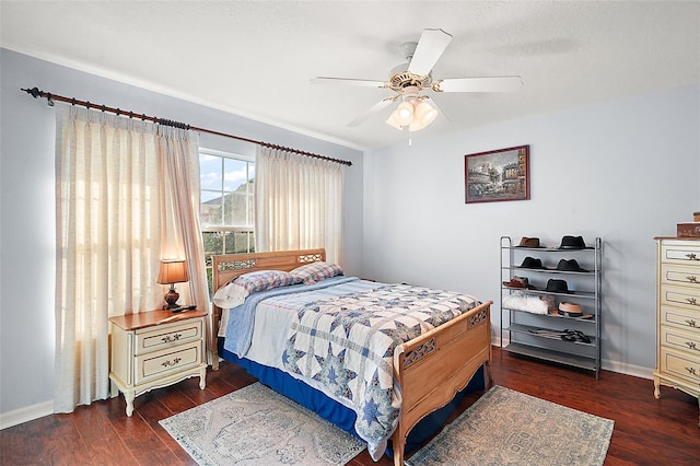 bedroom featuring ceiling fan and dark hardwood / wood-style floors