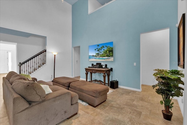 living room featuring a high ceiling