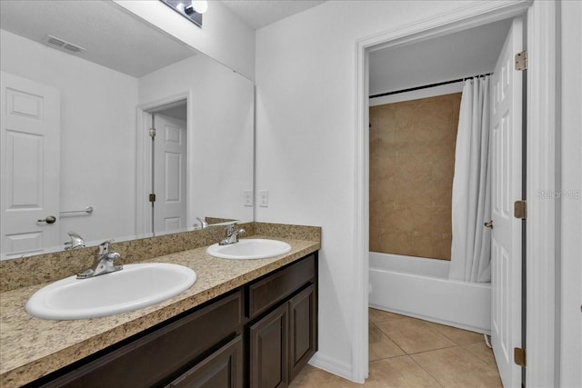 bathroom with tile patterned flooring, vanity, and shower / tub combo with curtain