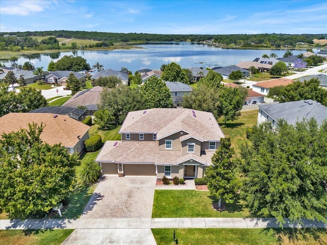 birds eye view of property with a water view