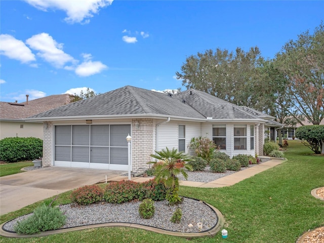 ranch-style house with a garage and a front yard