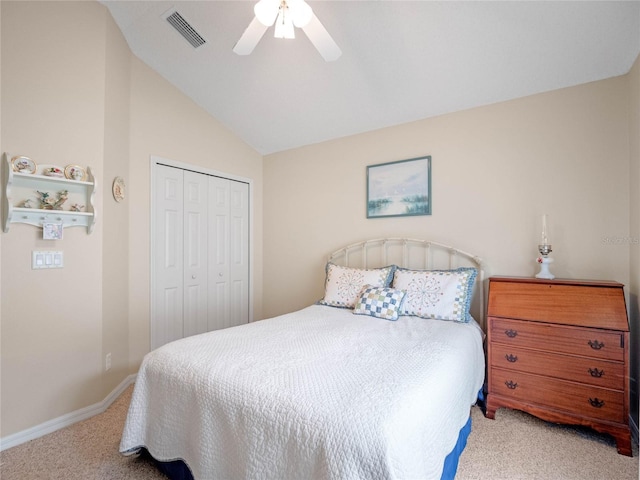 carpeted bedroom featuring lofted ceiling, a closet, and ceiling fan