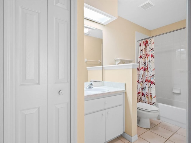 full bathroom with tile patterned flooring, vanity, toilet, and shower / bath combo with shower curtain